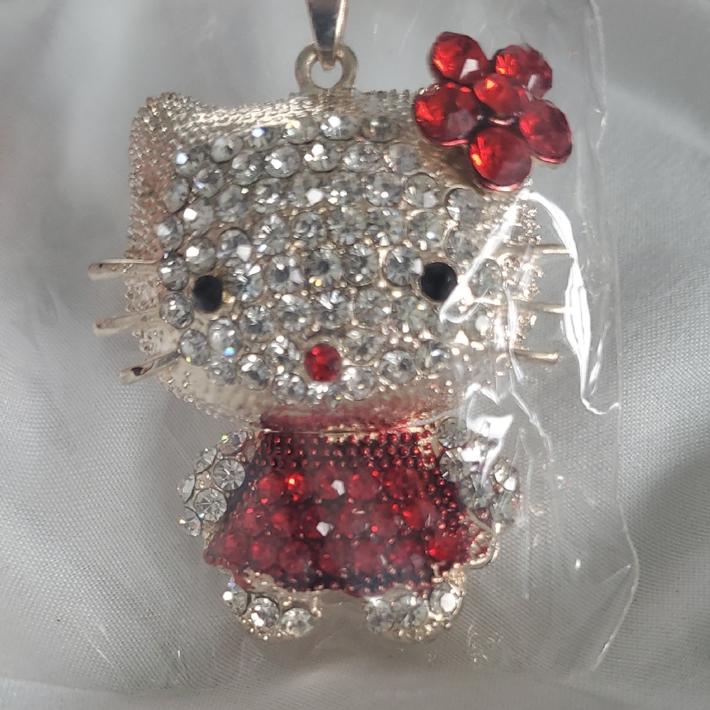 Sparkling Crystal Cat Pendant with Red Accents